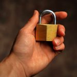 Cybersecurity Basics Everyone Should Know: Protect Yourself in the Digital World (2026 Guide) Hand holding secure padlock cybersecurity concept
